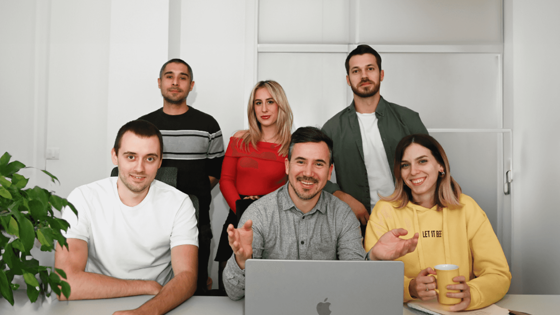 Four males and two females smiling.
